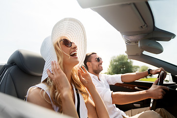 Image showing happy man and woman driving in cabriolet car