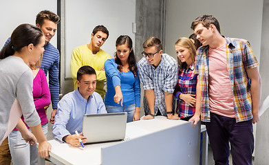 Image showing students and teacher with laptop at school