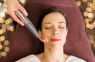 Image showing woman having hydradermie facial treatment in spa