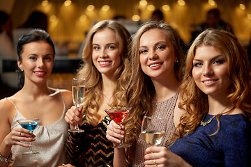 Image showing happy women drinks in glasses at night club