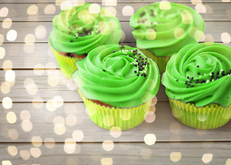 Image showing close up of cupcakes with green buttercream