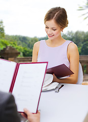 Image showing couple with menus at restaurant