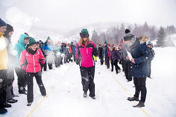 Image showing group of young people having blindfolded games competition