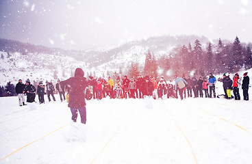 Image showing group of young people having a running in bag competition