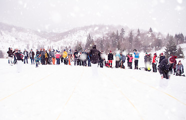 Image showing group of young people having a running in bag competition