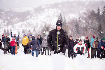 Image showing group of young people having a running in bag competition