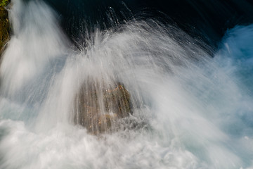 Image showing single stone in wild river