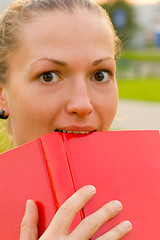Image showing woman with red book