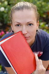 Image showing woman with red book