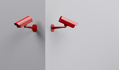 Image showing Two red security cameras