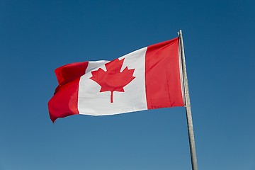 Image showing Canadian Flag Against Blue Sky