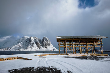 Image showing Drying flakes for stockfish cod fish in winter. Lofoten islands,