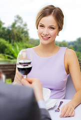 Image showing woman drinking wine with her man at restaurant