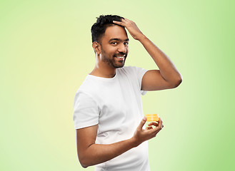 Image showing indian man applying hair wax or styling gel