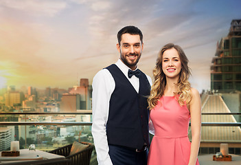 Image showing happy couple over restaurant lounge in singapore