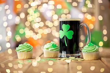 Image showing shamrock on glass of beer, green cupcake and coins