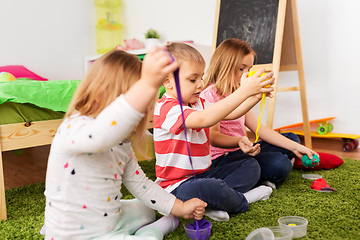 Image showing children with modelling clay or slimes at home