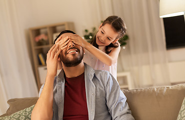 Image showing happy father and little daughter playing at home