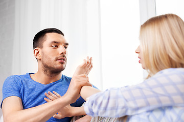 Image showing unhappy couple having argument at home