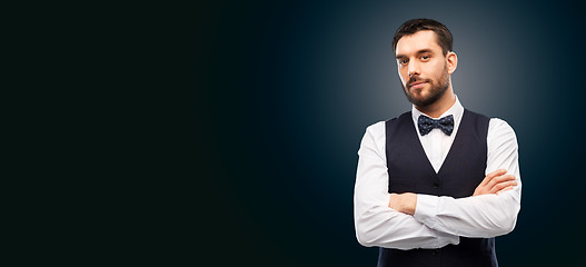 Image showing man in shirt and bowtie over black background