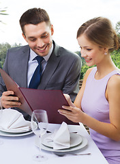 Image showing couple with menu at restaurant