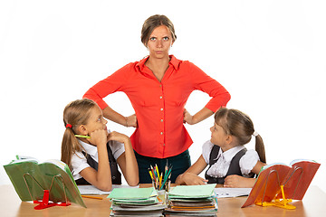 Image showing Children look at an evil teacher