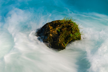 Image showing single stone in wild river