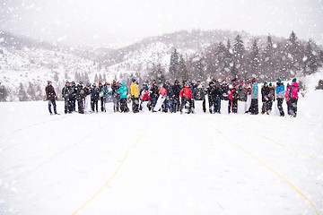 Image showing group of young people having a running in bag competition