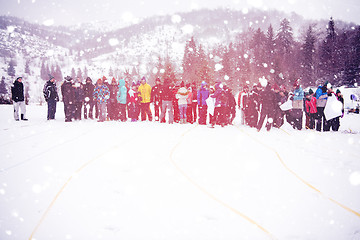 Image showing group of young people having a running in bag competition