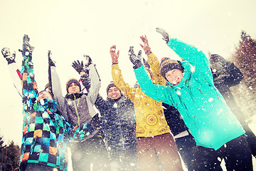 Image showing group of young people throwing snow in the air