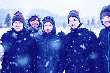 Image showing portrait of group young people in beautiful winter landscape