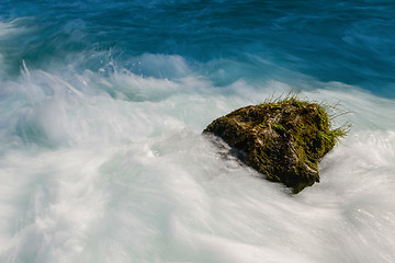 Image showing single stone in wild river