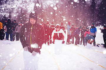 Image showing group of young people having a running in bag competition