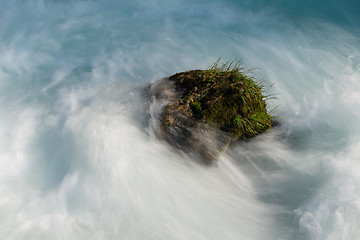 Image showing single stone in wild river