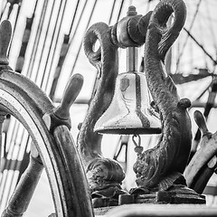 Image showing Ship\'s Bell and wheel the old sailboat, close-up 