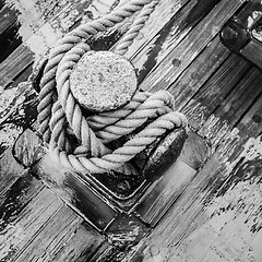 Image showing Bollard with a rope on the wooden deck of a sailing vessel, clos