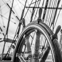 Image showing Ship\'s Bell and wheel the old sailboat, close-up 