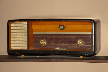 Image showing Old vintage radio on the wooden shelf 