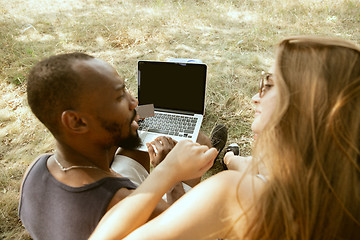 Image showing Young multiethnic international couple outdoors