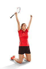 Image showing Young woman badminton player as winner posing over white background