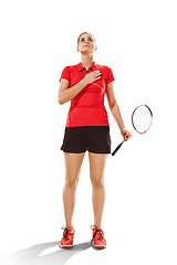 Image showing Young woman badminton player standing over white background