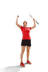 Image showing Young woman badminton player as winner posing over white background