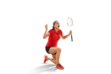 Image showing Young woman badminton player as winner posing over white background