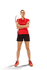 Image showing Young woman badminton player standing over white background