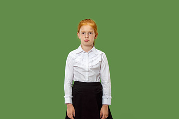 Image showing Young serious thoughtful teen girl. Doubt concept.