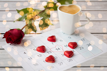 Image showing close up of calendar, hearts, coffee and red rose