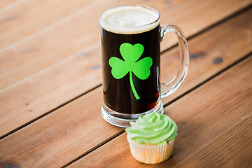 Image showing glass of beer with shamrock and green cupcake