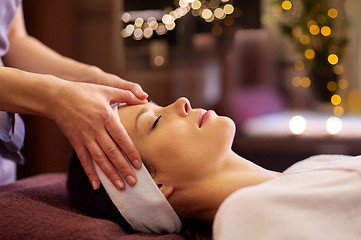 Image showing woman having face and head massage at spa