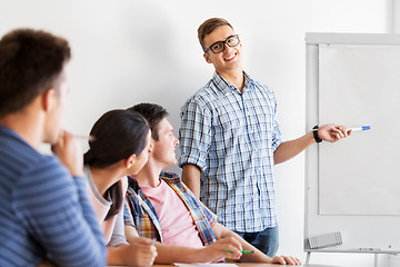 Image showing group of high school students with flip chart