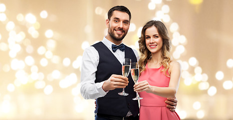 Image showing happy couple with champagne glasses toasting